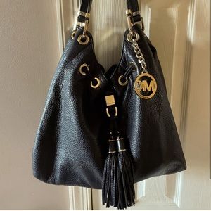 Michael Kors hobo bag. Black with gold. Used in good condition